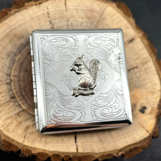 Metal card holder featuring detailed squirrel embellishment