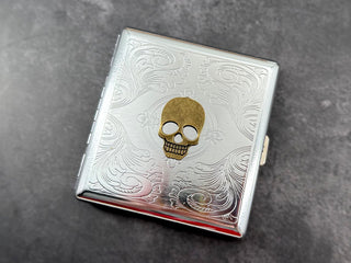 Silver metal card holder with antique bronze skull centerpiece