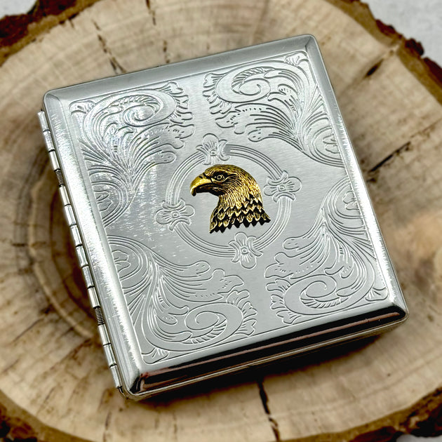 Wildlife-inspired eagle pocket case displayed on a wooden tray