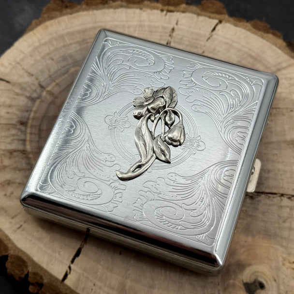 Art Nouveau floral business card holder with a raised bluebell spray and polished silver finish