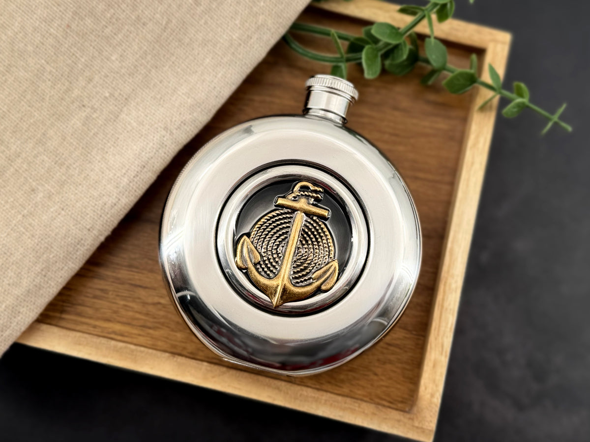 Round window flask with bronze anchor centerpiece