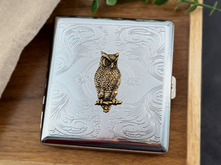 Bronze owl metal cigarette case with stamped scrollwork background