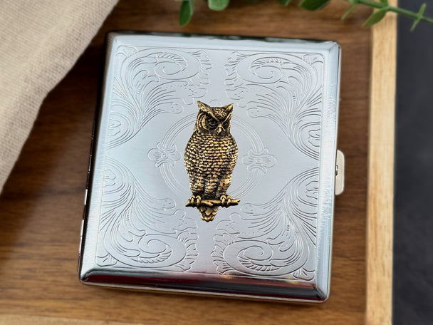 Bronze owl metal cigarette case with stamped scrollwork background