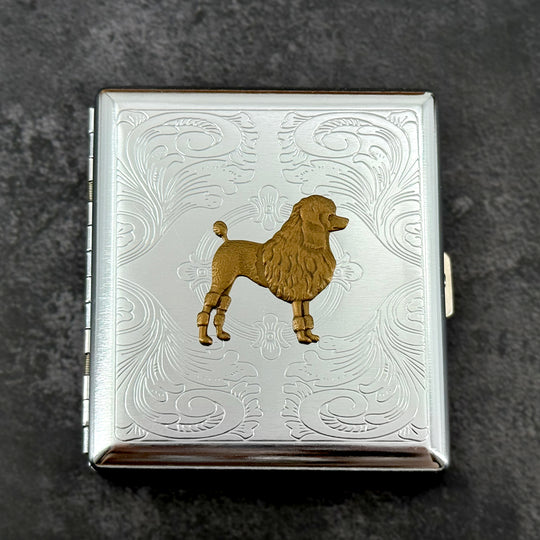 Bronze poodle metal cigarette case with silver stamped scrollwork background