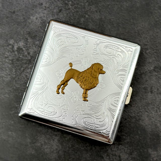 Handmade silver cigarette case featuring a raised bronze poodle