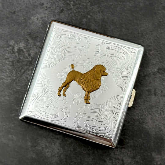 Handmade silver cigarette case featuring a raised bronze poodle