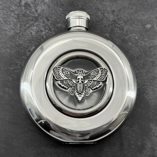 Mirror-finish 5 oz hip flask featuring a resin-embedded skull moth centerpiece
