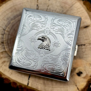 Wildlife-inspired cigarette case with raised eagle accent and decorative engraved background