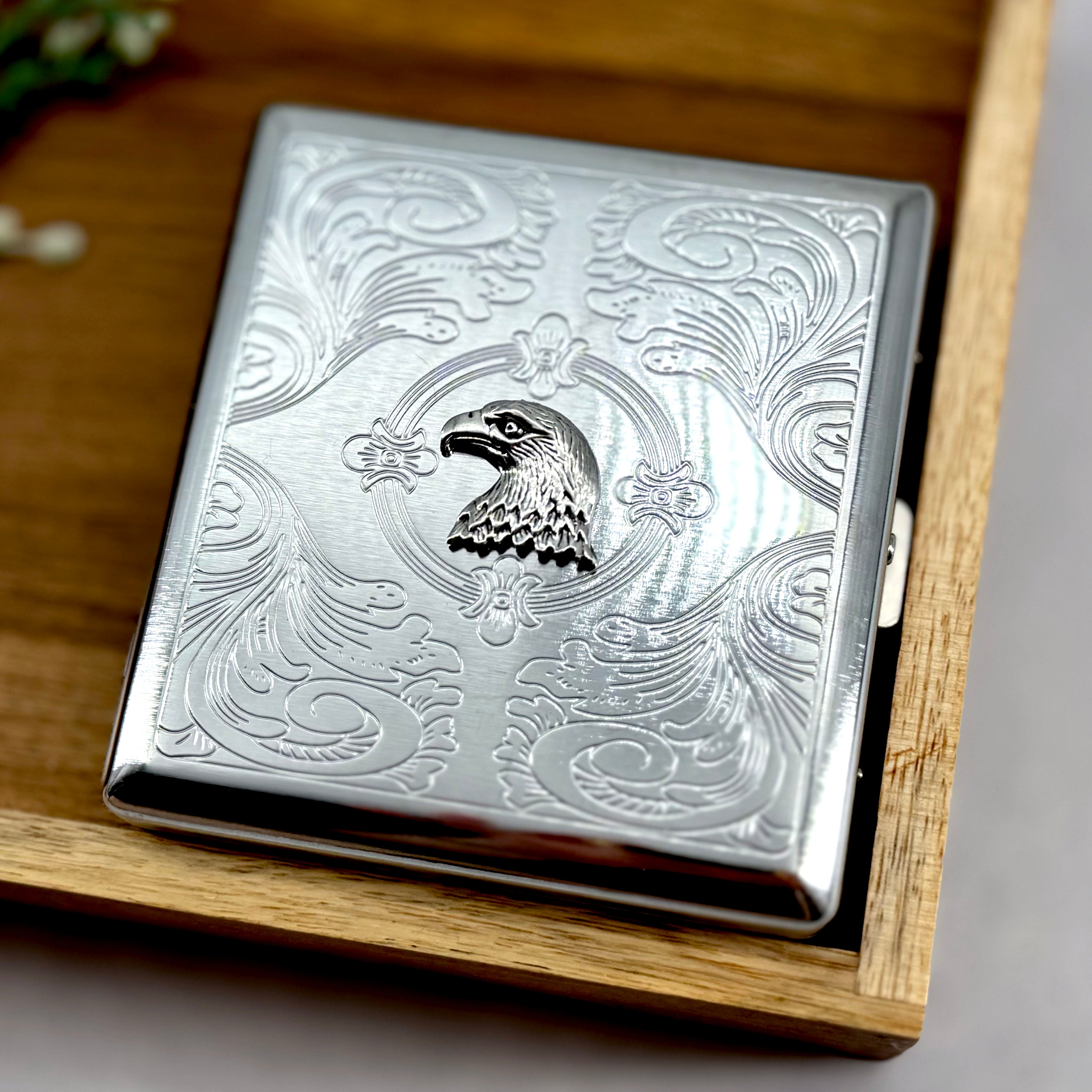 Patriotic cigarette case featuring eagle motif and engraved ornamental detailing