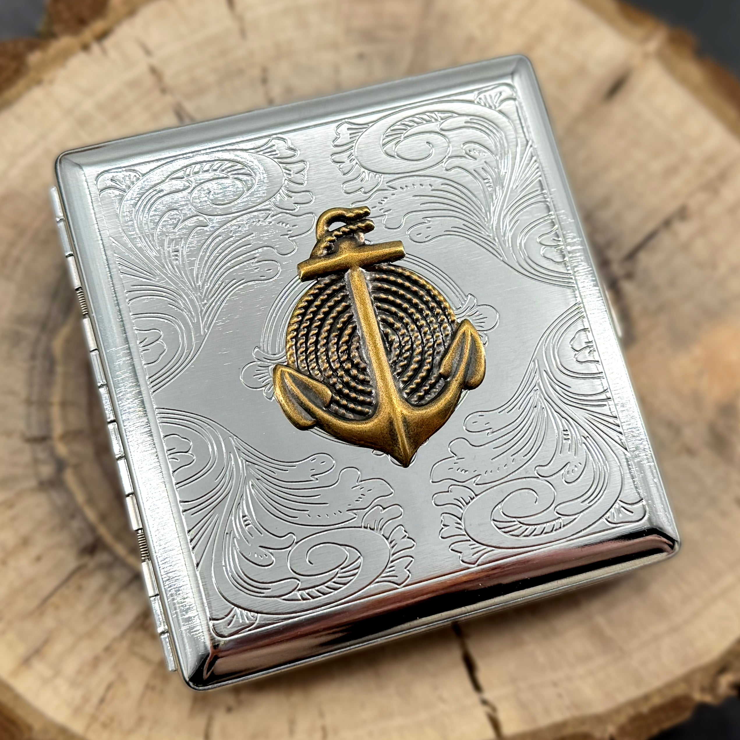 Nautical anchor card holder case on wood surface