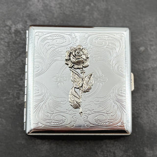 Handmade floral wallet featuring a sculpted rose on a polished silver finish.