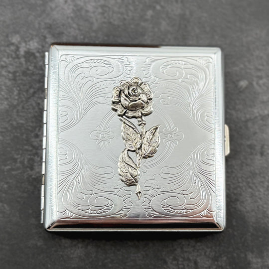 Handmade floral wallet featuring a sculpted rose on a polished silver finish.