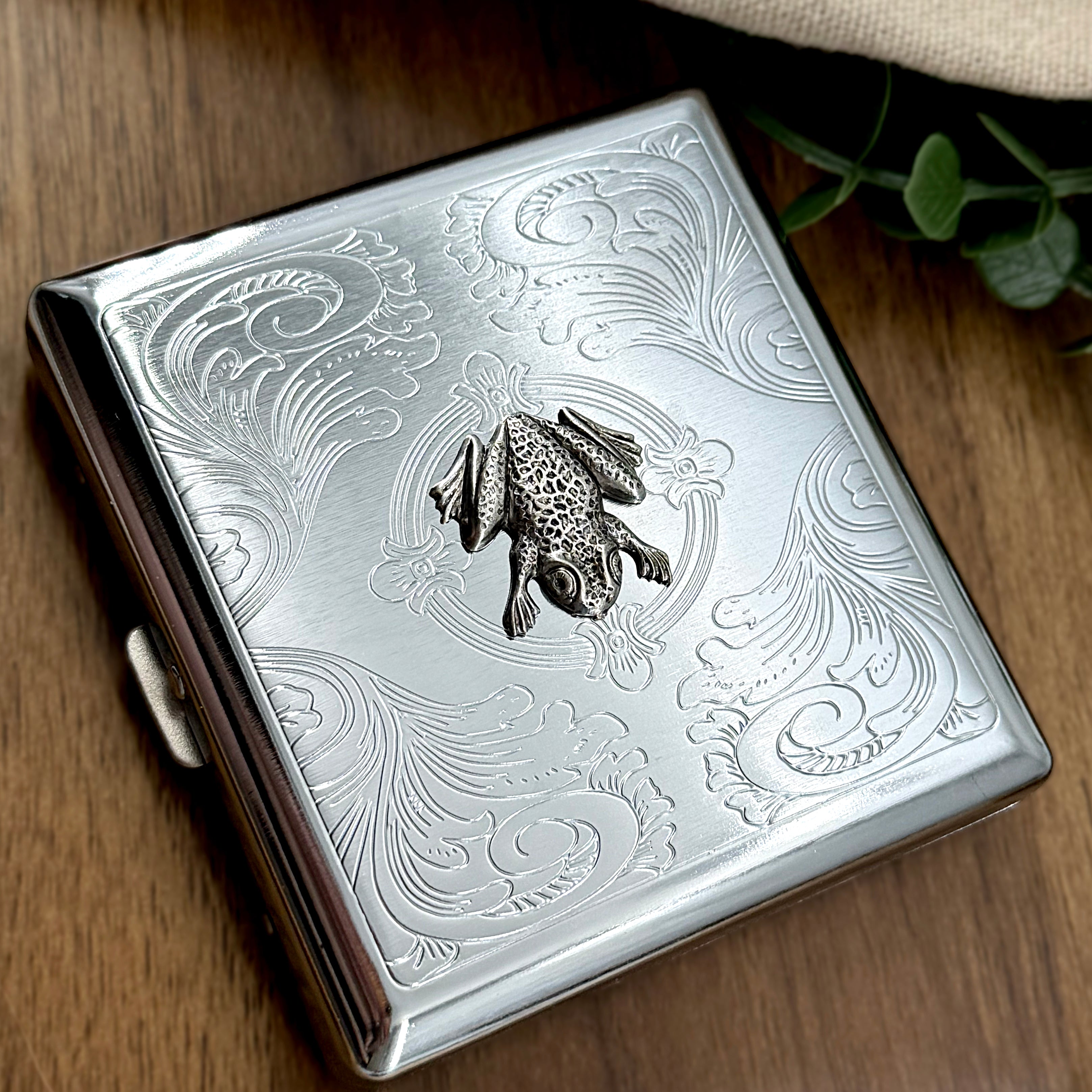 Handmade frog business card holder with a detailed silver amphibian design.