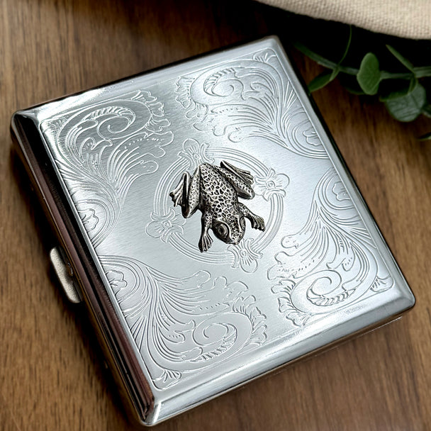 Handmade frog business card holder with a detailed silver amphibian design.