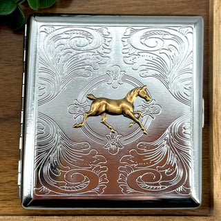 Open horse cigarette case showing storage for cigarettes cards or cash