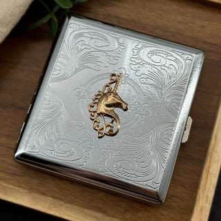 Handmade unicorn business card holder featuring a gold fantasy design on silver metal.