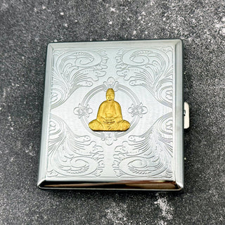 Decorative Buddha cigarette case with raised golden Buddha and engraved ornamental detailing