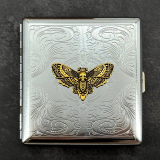 Gothic metal card case with raised golden Death's-head hawkmoth and decorative scrollwork