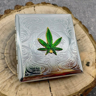 Decorative metal pocket case with vibrant green marijuana leaf centerpiece