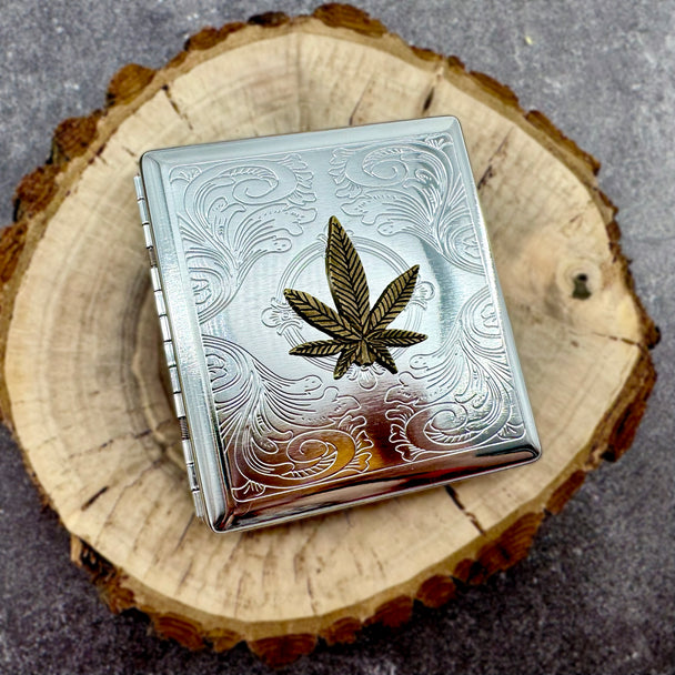 Handmade cannabis cigarette case displayed on natural wood slice