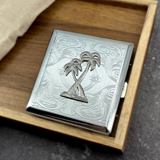 Tropical palm tree card holder with engraved metal finish and secure snap closure