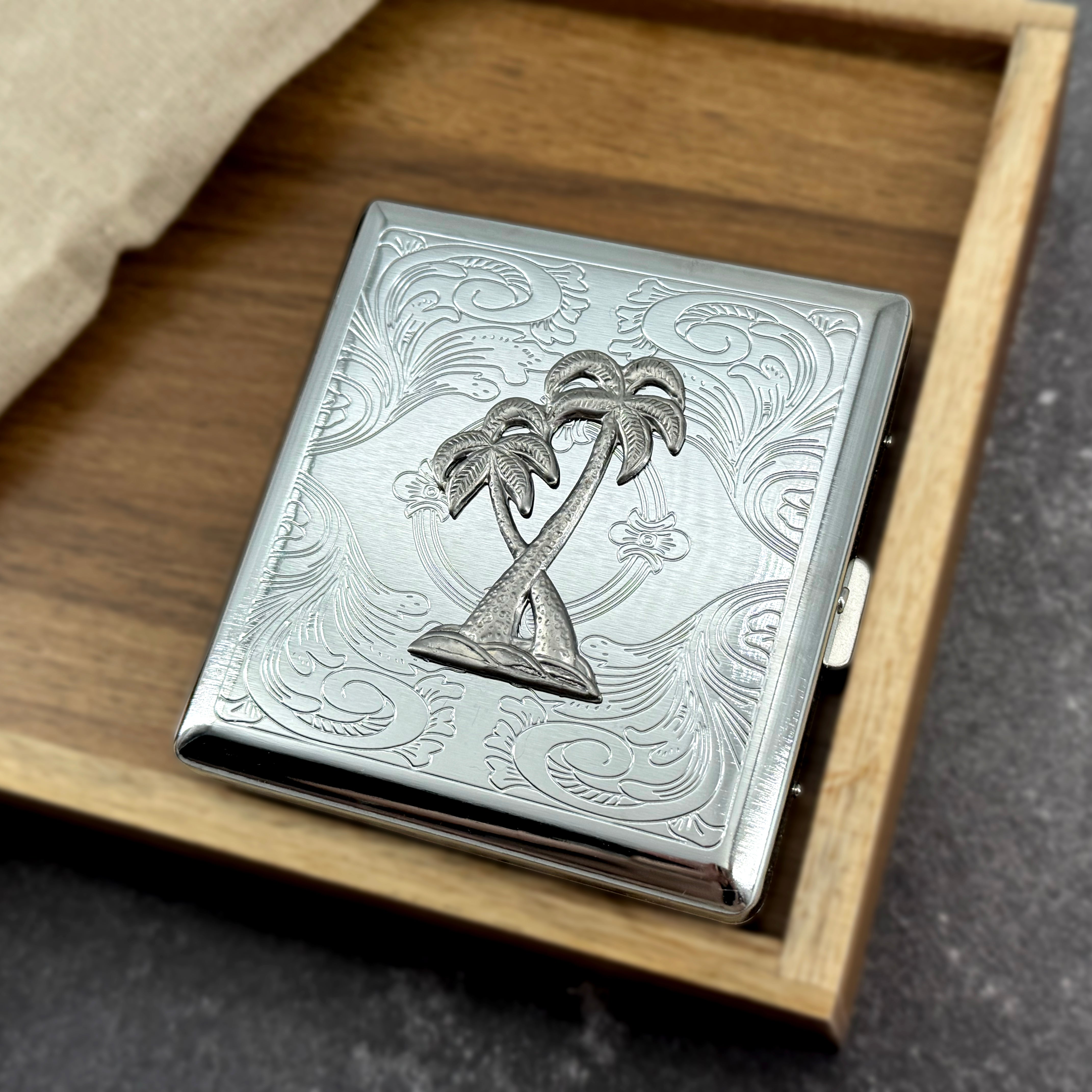 Tropical palm tree card holder with engraved metal finish and secure snap closure
