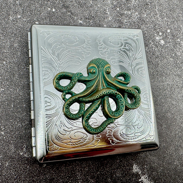 Silver card holder with kraken emblem and decorative stamped pattern