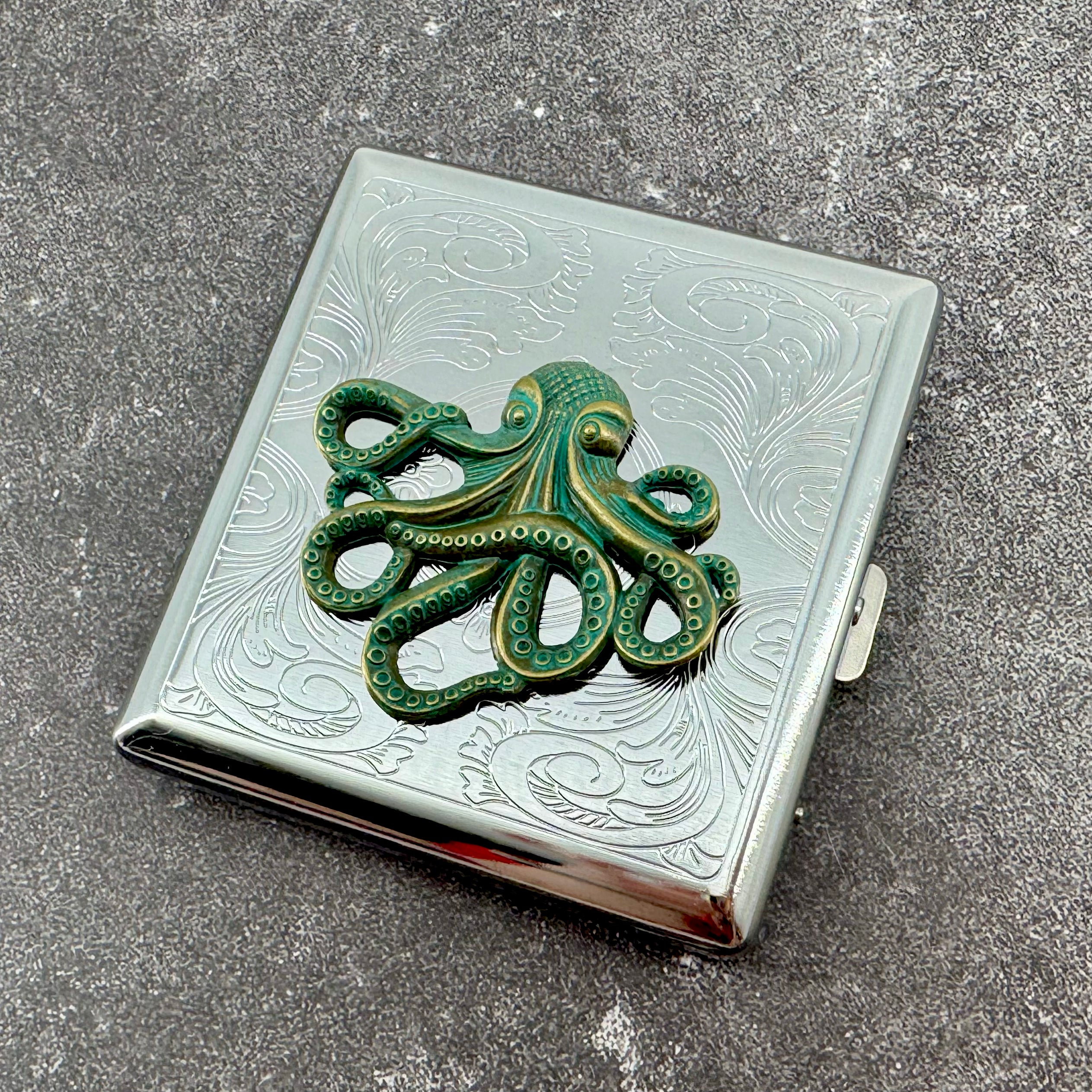 Handmade octopus cigarette case with green kraken design on silver metal case