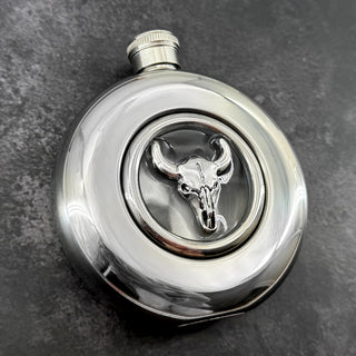 Mirror-finish 5 oz hip flask featuring a silver-toned bull skull centerpiece