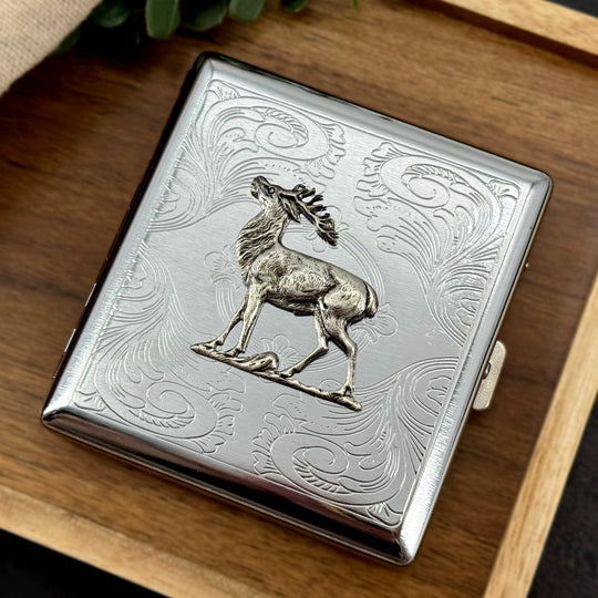 Rustic bull elk cigarette case with decorative stamped metal scrollwork
