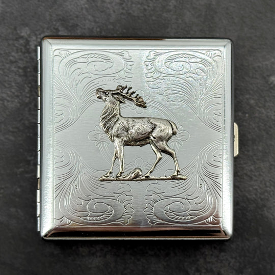 Close-up of raised elk embellishment on a handcrafted silver metal case