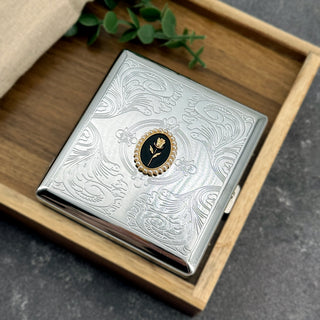 Vintage-inspired rose card holder with decorative oval frame and engraved metal finish