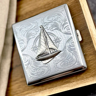 Nautical pocket case featuring detailed sailboat embellishment