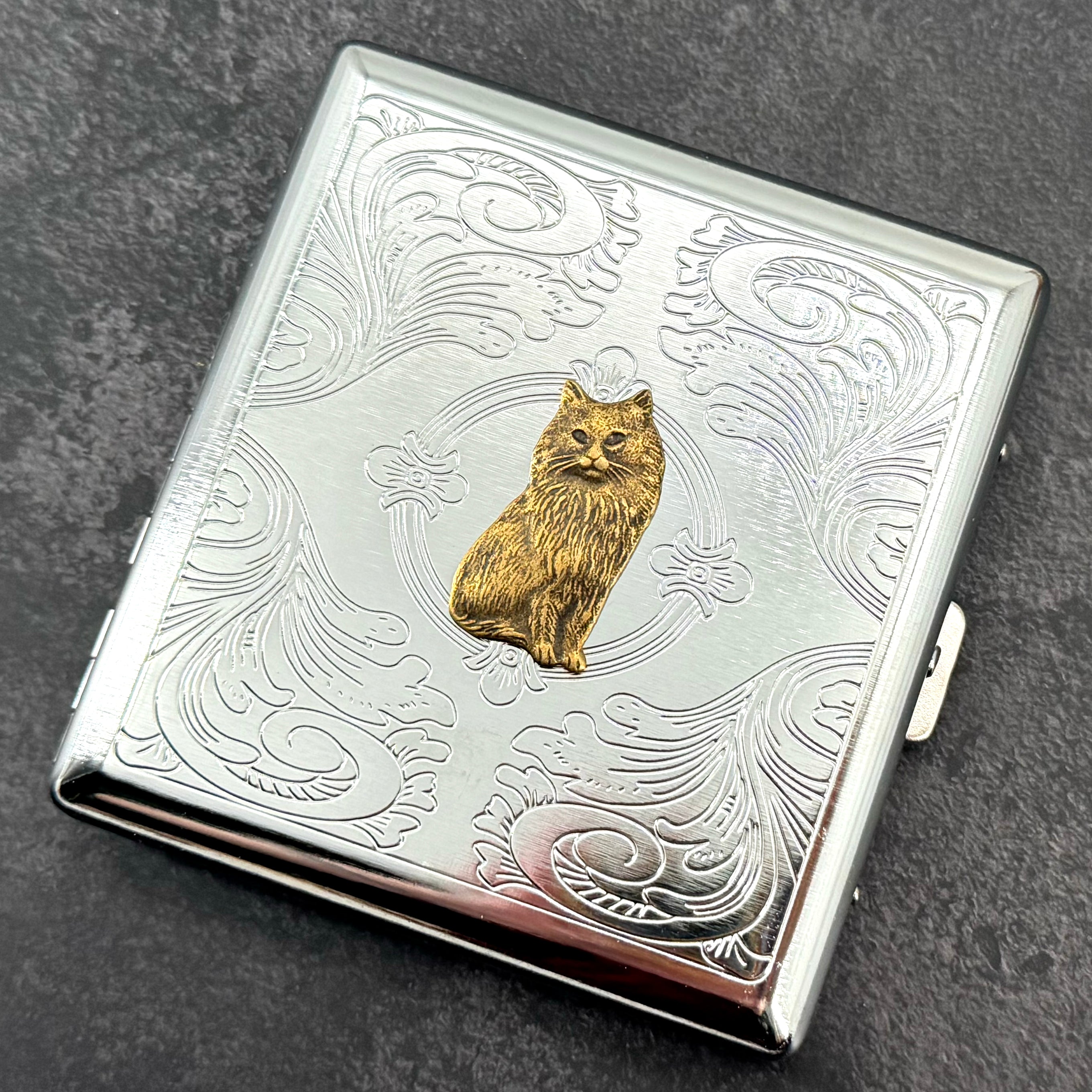 Handmade cat cigarette case displayed closed with raised longhair cat detail