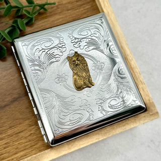 Compact pocket case for cigarettes, cards, cash, or slim pre-rolls with cat motif