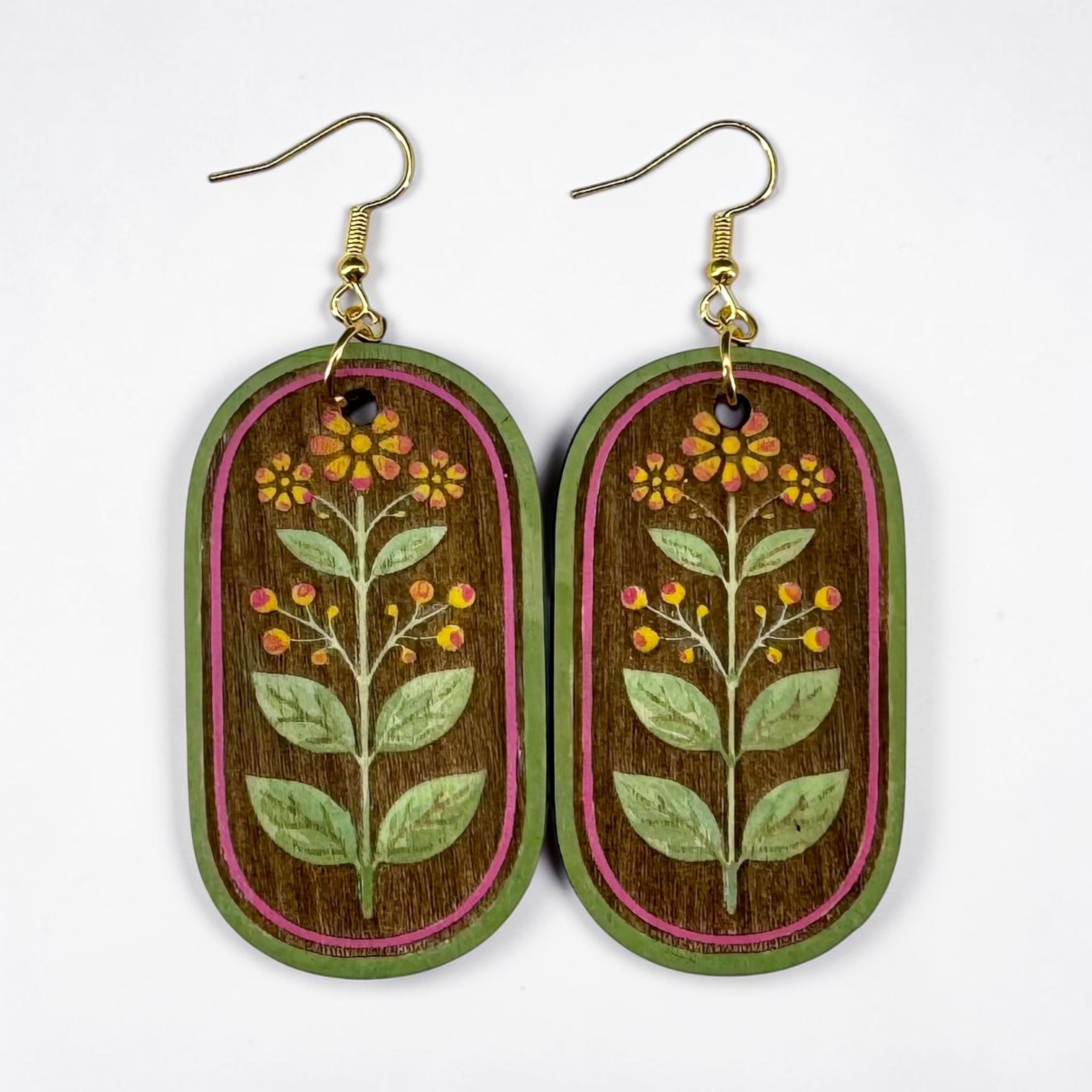 Wooden earrings with floral design on a white background