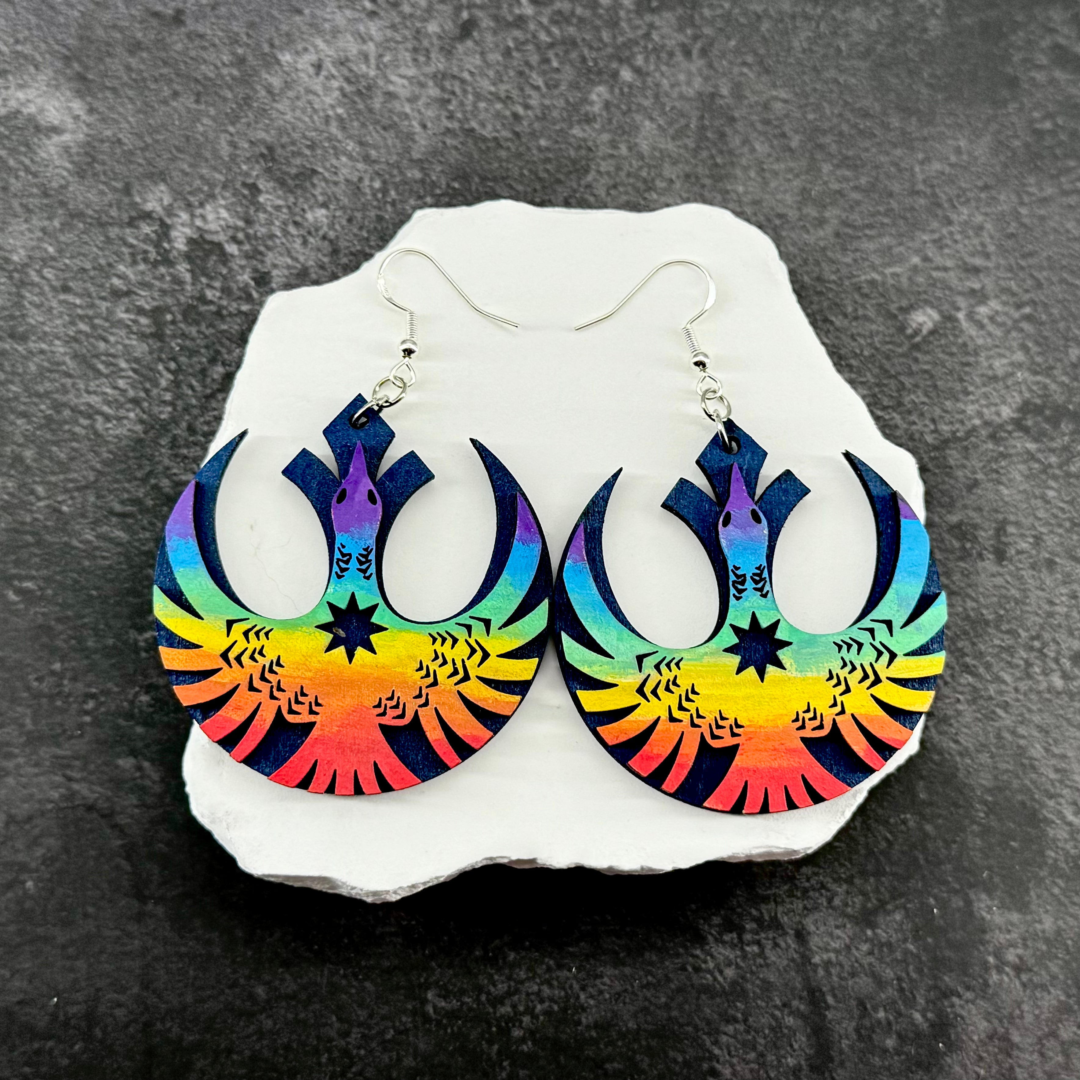 Laser cut wooden rebel loon earrings with rainbow hand-painted finish