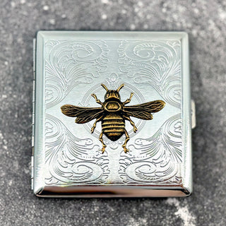 Handmade Queen Bee cigarette case featuring raised golden bee design with engraved ornamental background