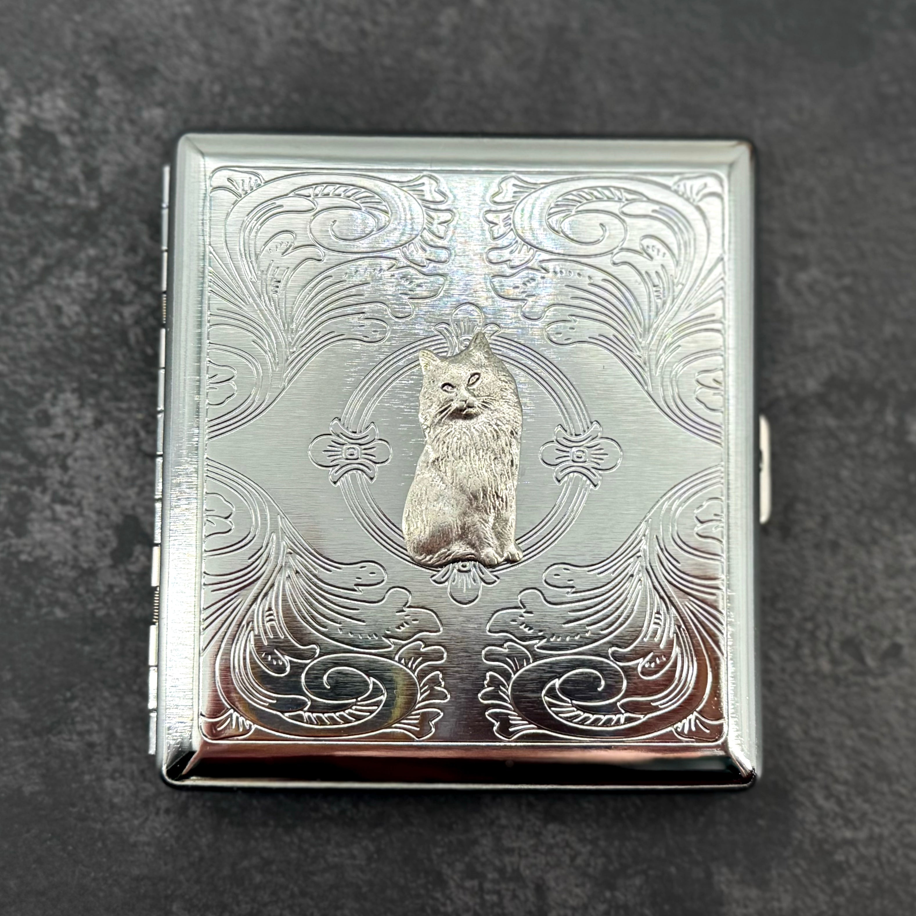 Handmade cat cigarette case with raised feline charm on silver stamped metal case