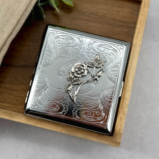 Handmade botanical cigarette case with flower and leaf embellishment