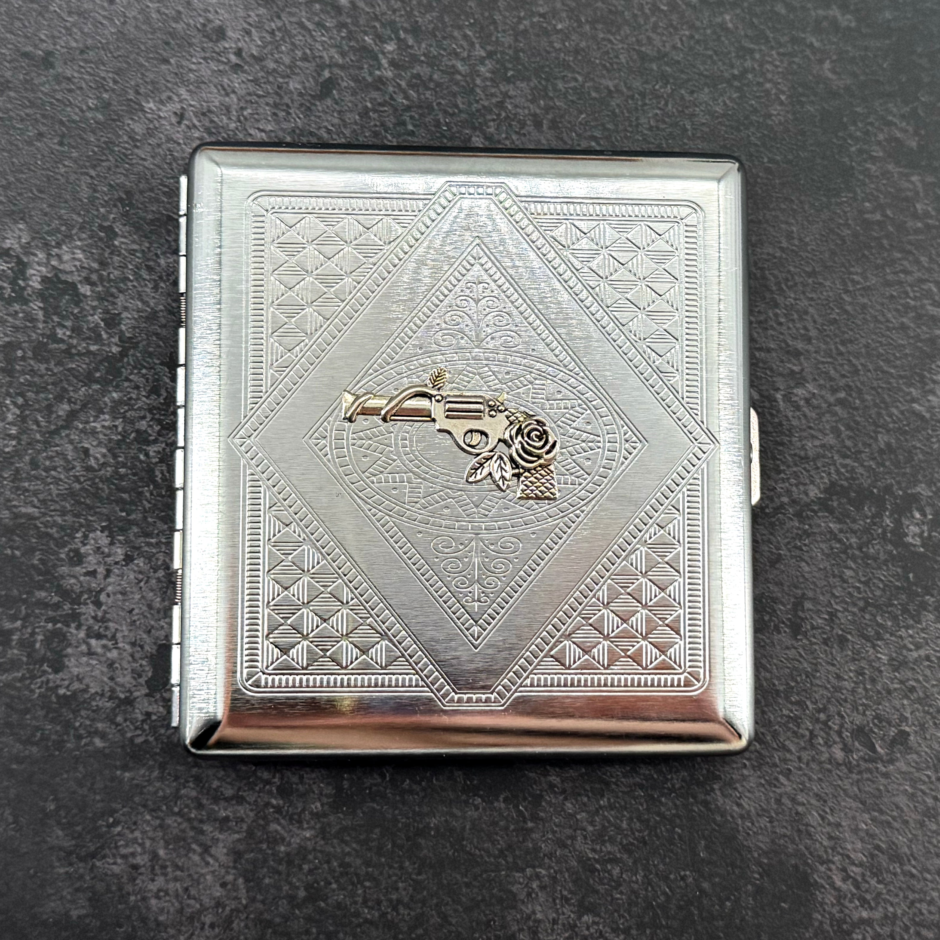 Western-inspired cigarette case closed front view with polished silver finish