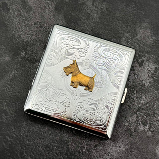 Open Scottie dog cigarette case showing interior storage for cigarettes cards or cash