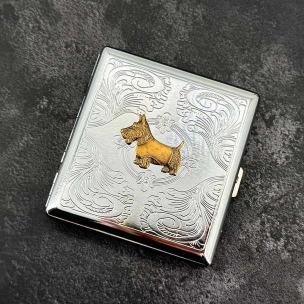 Open Scottie dog cigarette case showing interior storage for cigarettes cards or cash