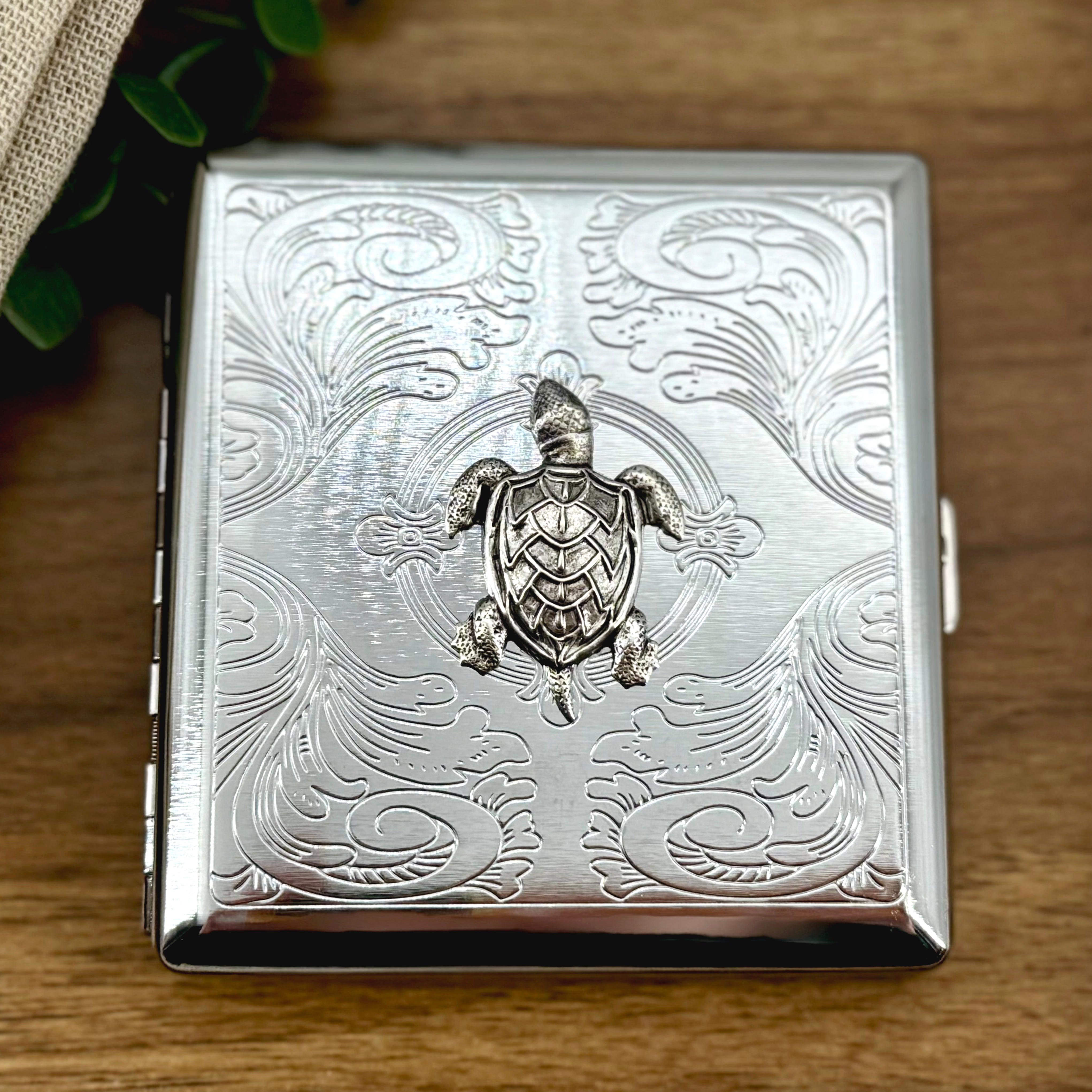 Handmade sea turtle cigarette case with raised turtle charm on stamped silver metal case