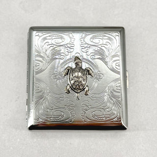Back of silver stamped metal sea turtle cigarette case with polished finish