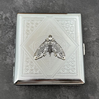Gothic silver card holder featuring a detailed skull moth centerpiece