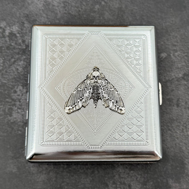 Gothic silver card holder featuring a detailed skull moth centerpiece