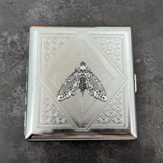 Silver death’s-head moth metal cigarette case with detailed stamped background