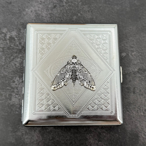 Silver death’s-head moth metal cigarette case with detailed stamped background