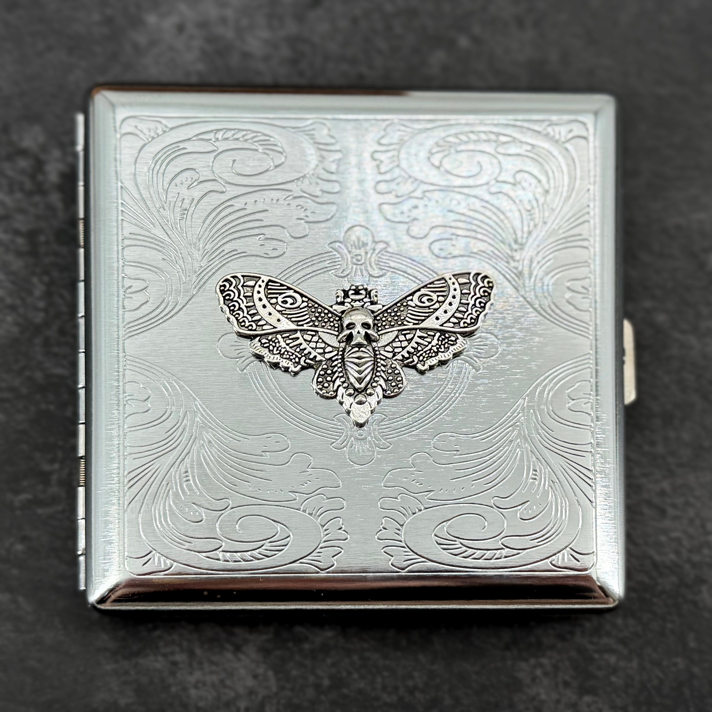 Silver option gothic metal card case with raised silver Death's-head hawkmoth and decorative stamped scrollwork